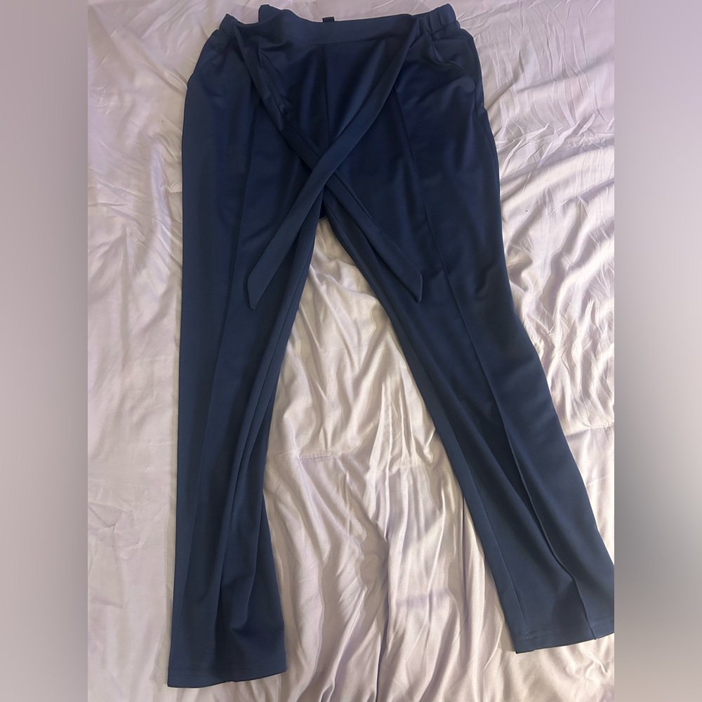 Never worn trousers. Tie around waist and navy blue. Size 2X.